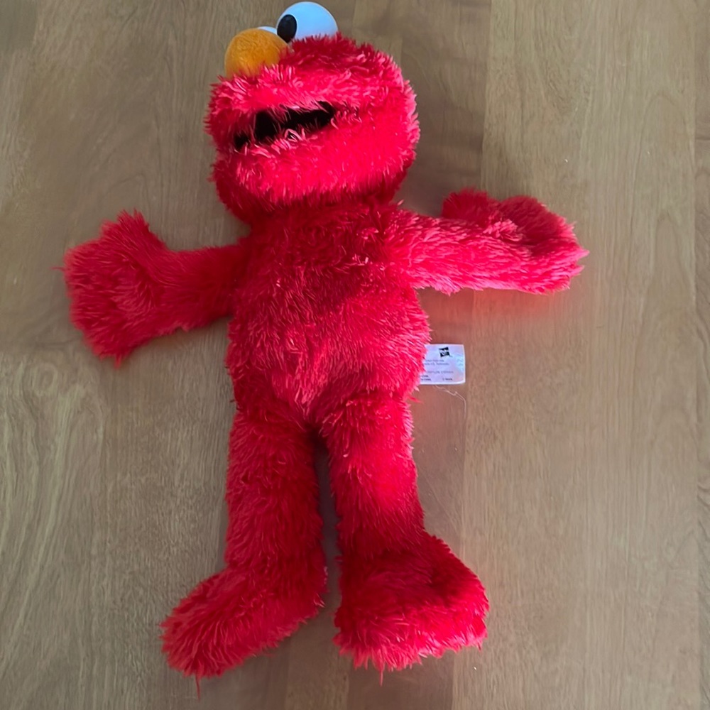 Little laughs tickle me Elmo